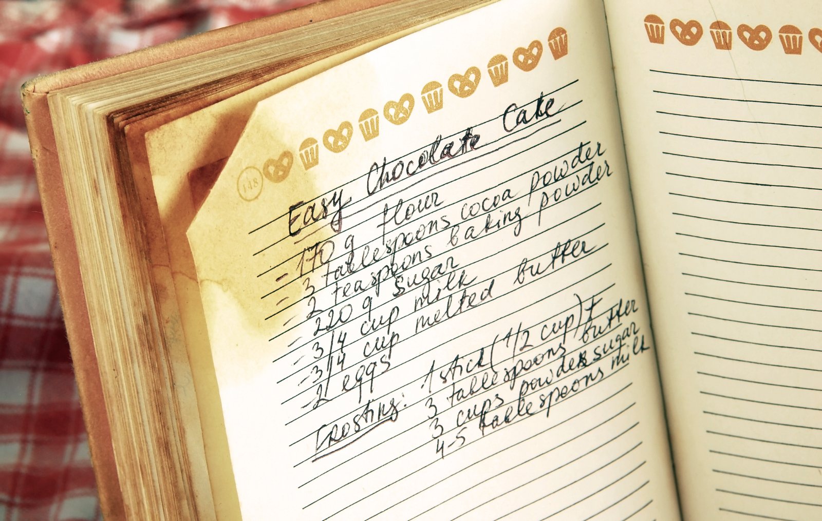 Handwritten recipe for easy chocolate cake in a notebook